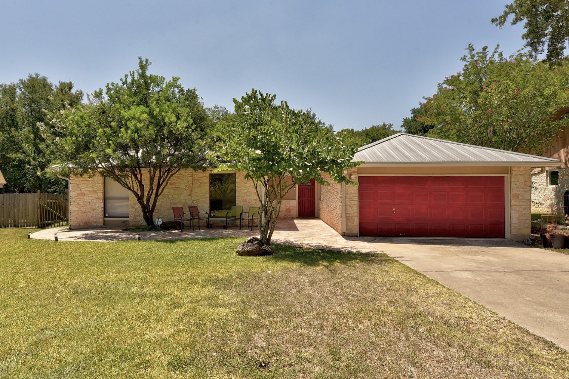 3405 Cactus Wren Way Austin, TX 78746 - Photo 1 of 1 a view of a house with a yard and garage