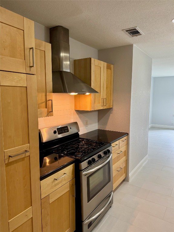 1009 Alegria Road Austin, TX 78757 - Photo 11 of 27 a kitchen with granite countertop a stove and a refrigerator
