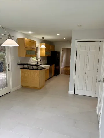 a view of a kitchen with a sink