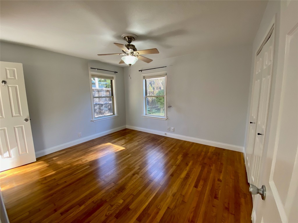 1009 Alegria Road Austin, TX 78757 - Photo 15 of 27 wooden floor in an empty room with a window