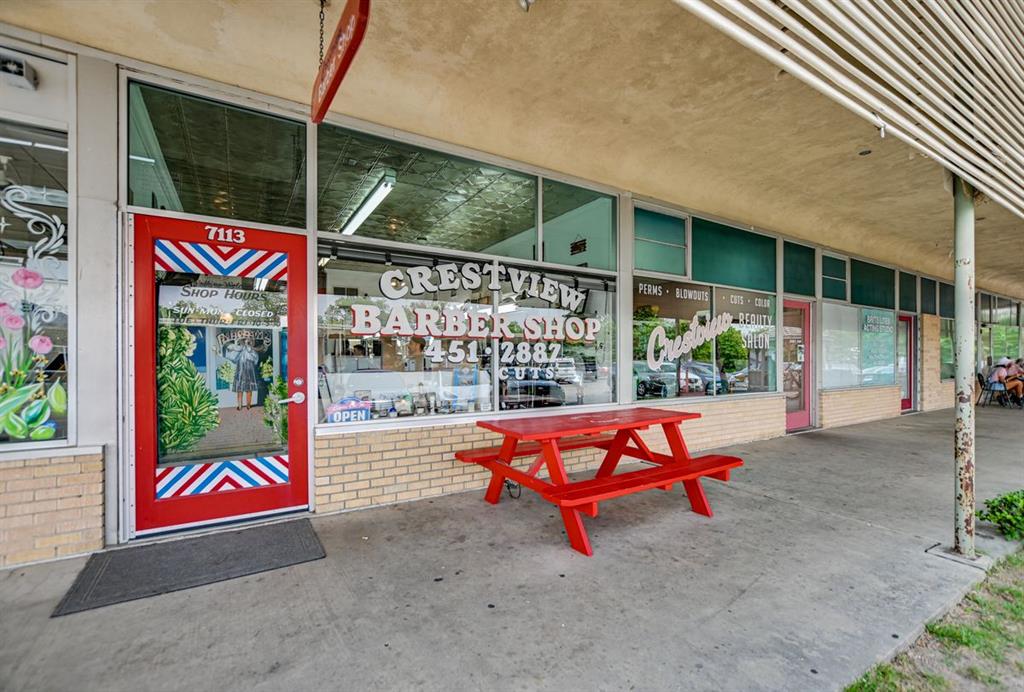1009 Alegria Road Austin, TX 78757 - Photo 26 of 27 a bench is sitting in front of a building