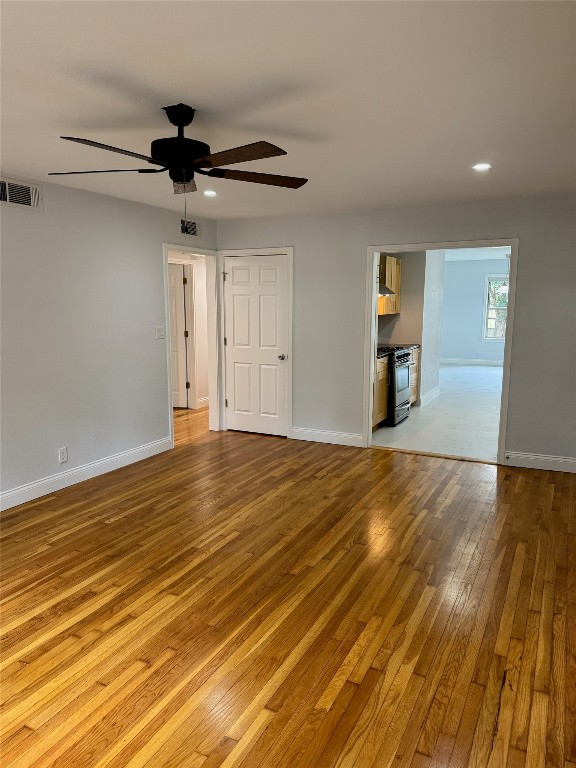 1009 Alegria Road Austin, TX 78757 - Photo 8 of 27 a view of empty room and wooden floor