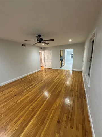 a view of a room with a wooden floor