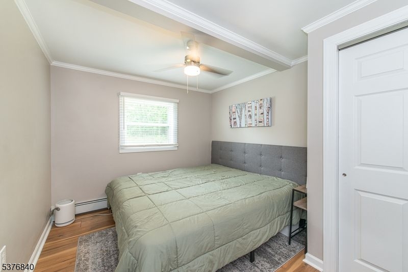 25 East Shore Lake Owassa Road Newton, NJ 07860 - Photo 14 of 19 a bedroom with a large bed and a window