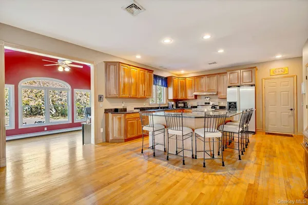 a view of a kitchen with dining table and chairs