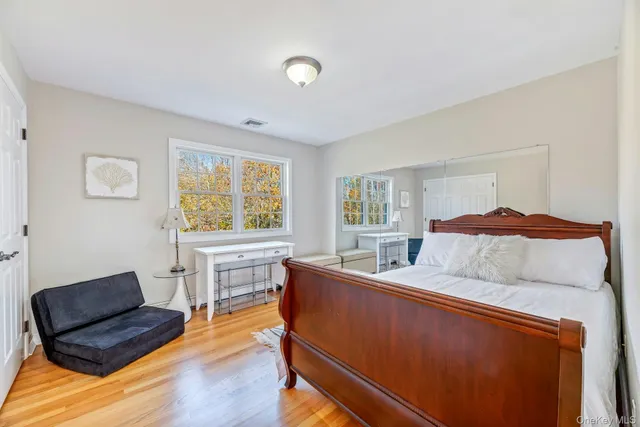 a bedroom with furniture and a window