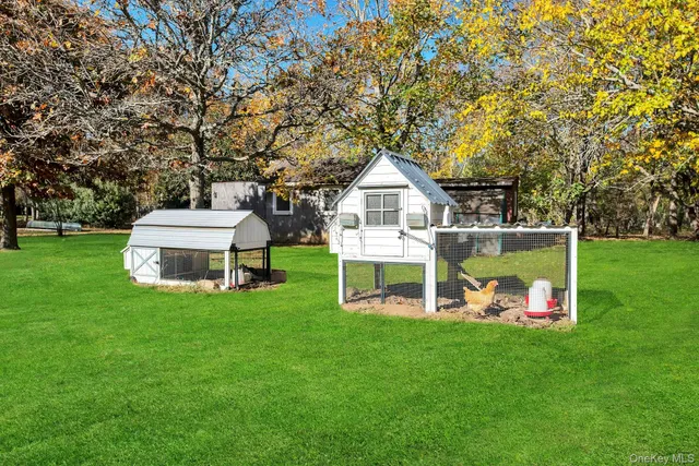 a view of a house with a yard porch and sitting area