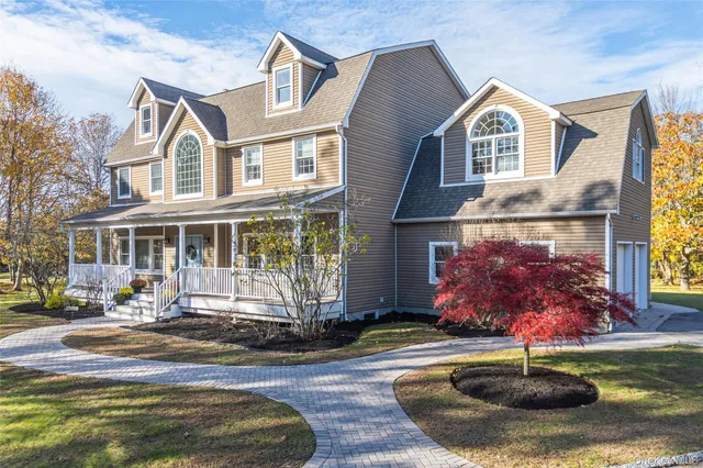 a front view of a house with yard