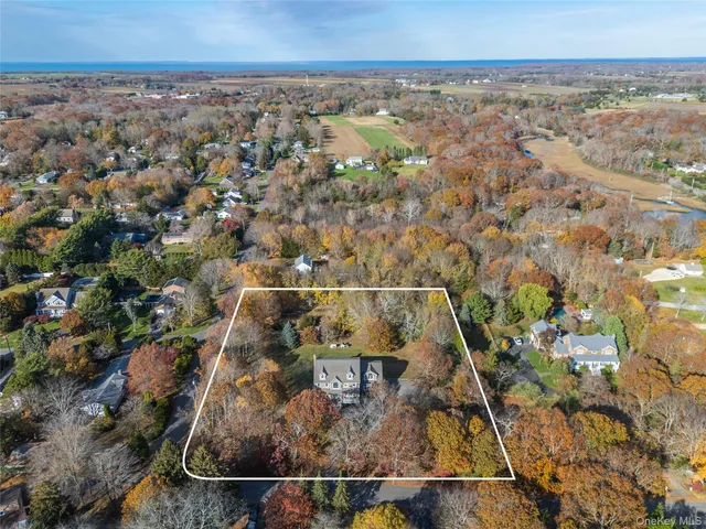 an aerial view of residential houses with outdoor space