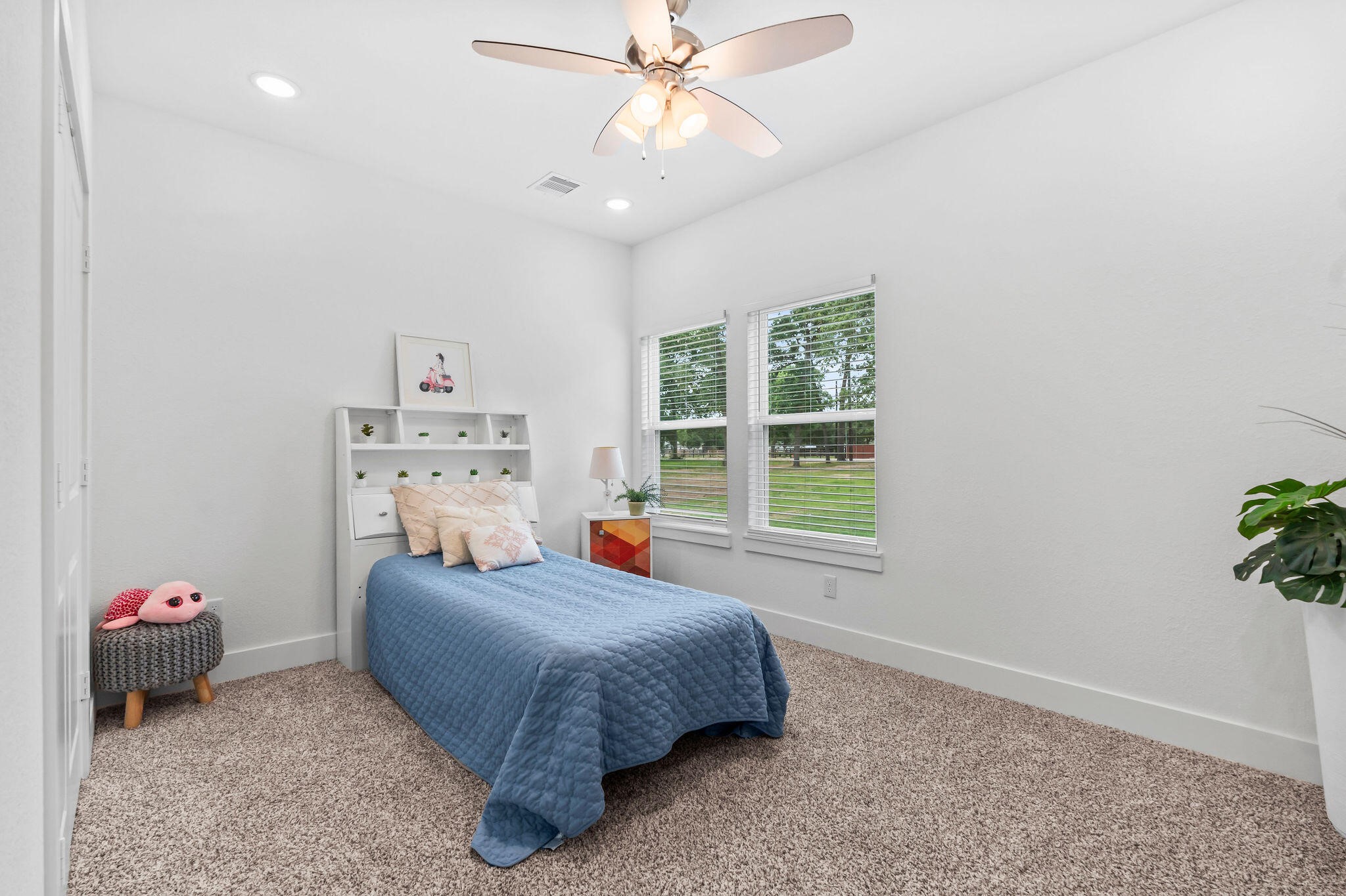 39645 Bosque Road Hempstead, TX 77445 - Photo 26 of 37 a bedroom with a bed and a chandelier