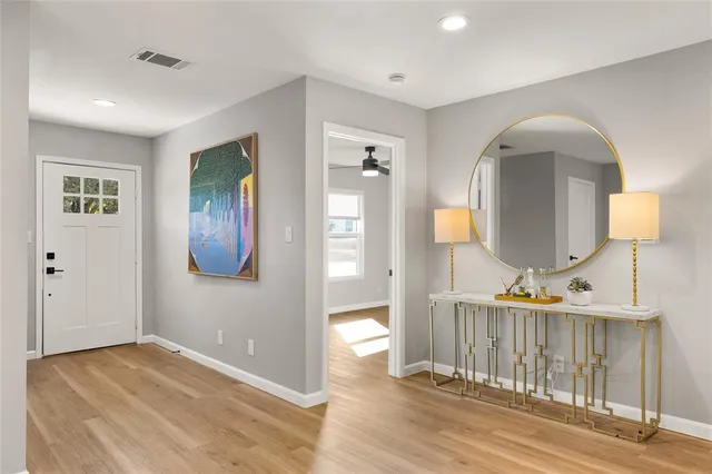 a view of a living room and wooden floor
