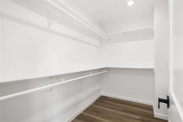 a view of an empty walk in closet