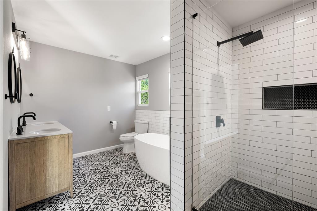 2728 Livingston Avenue Fort Worth, TX 76110 - Photo 22 of 37 a bathroom with a sink toilet and shower