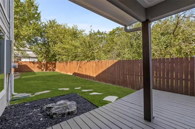 a view of a backyard with wooden floor