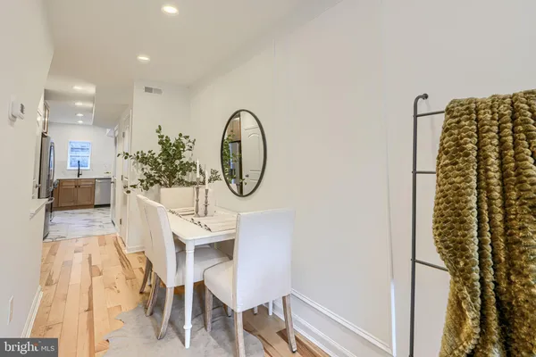 a kitchen with stainless steel appliances granite countertop a sink a stove and cabinets