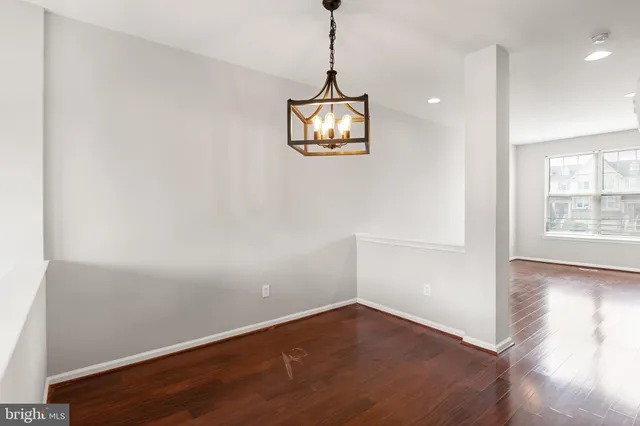 a kitchen with granite countertop a sink and cabinets