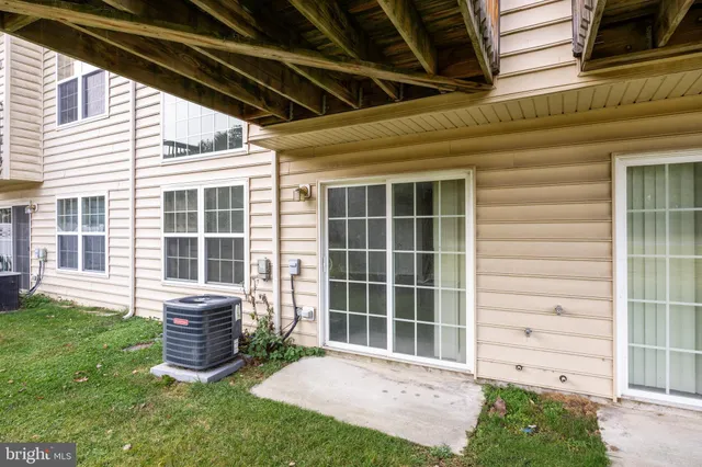 a view of a field with an trees in the background