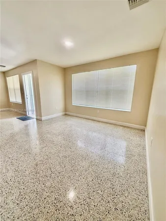 an empty room with a natural light