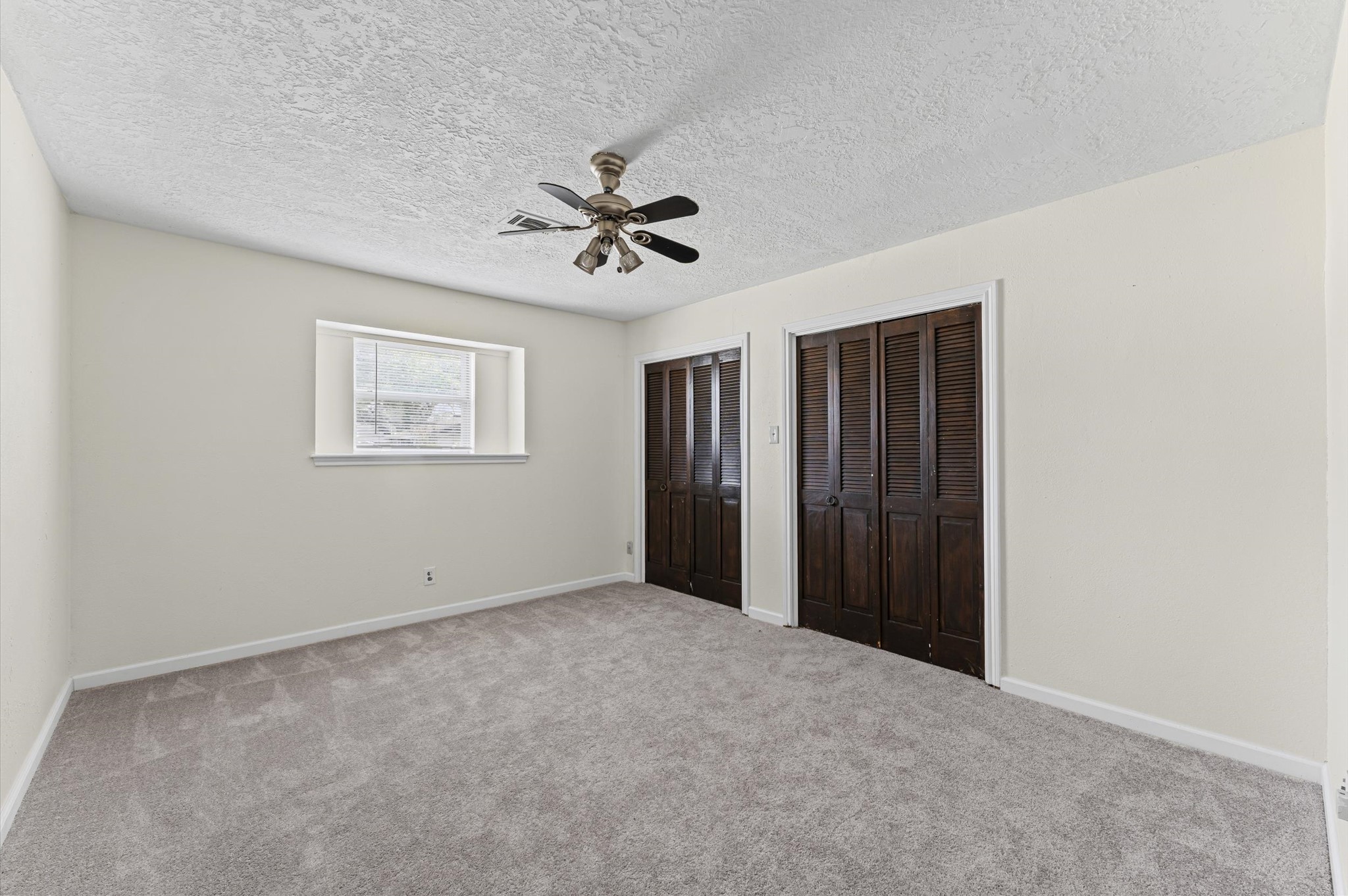 2709 Adams Street Alvin, TX 77511 - Photo 19 of 32 a view of an empty room with a window