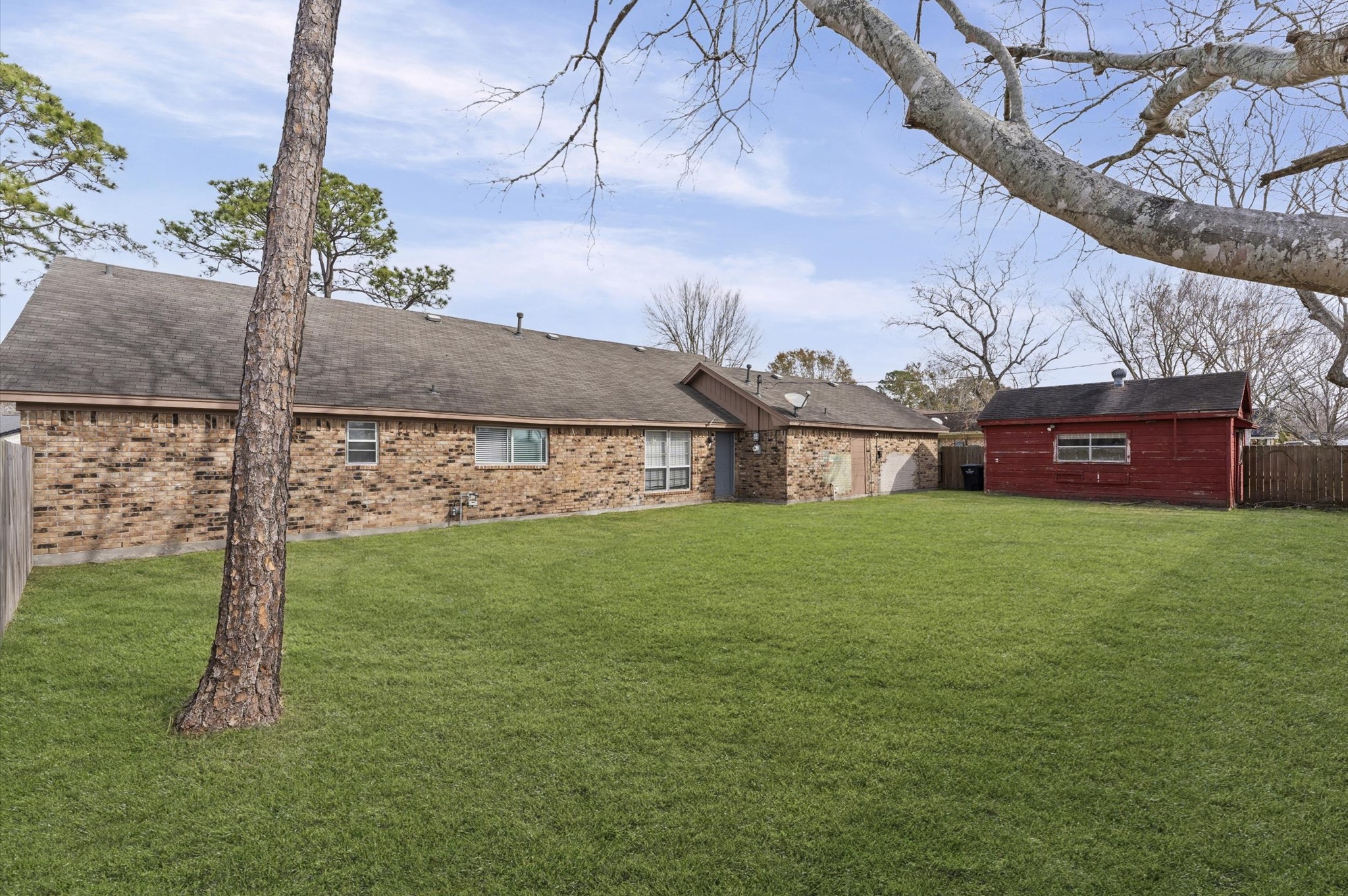 2709 Adams Street Alvin, TX 77511 - Photo 28 of 32 a view of a house with a yard
