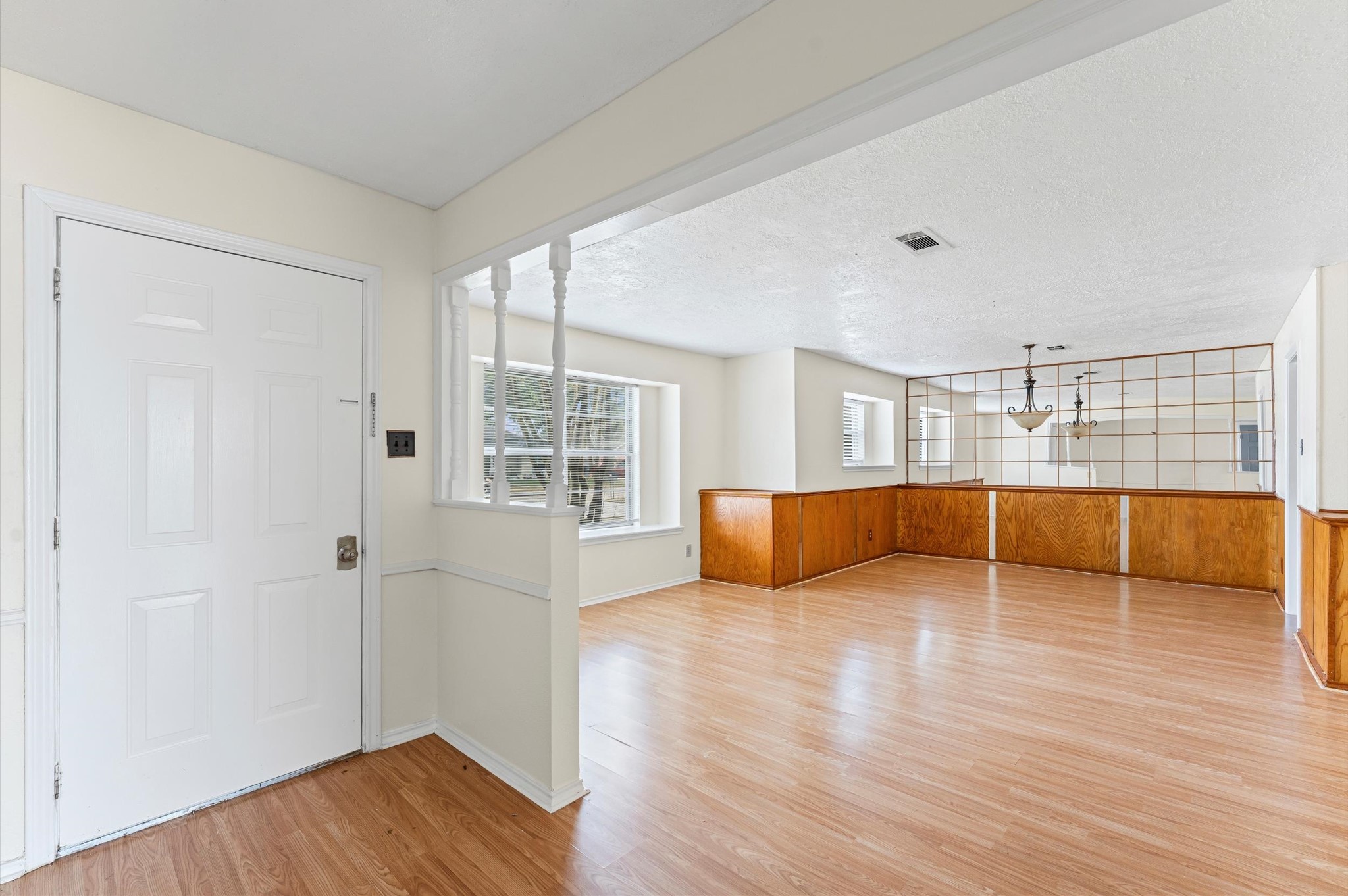 2709 Adams Street Alvin, TX 77511 - Photo 5 of 32 a view of a room with wooden floor and window