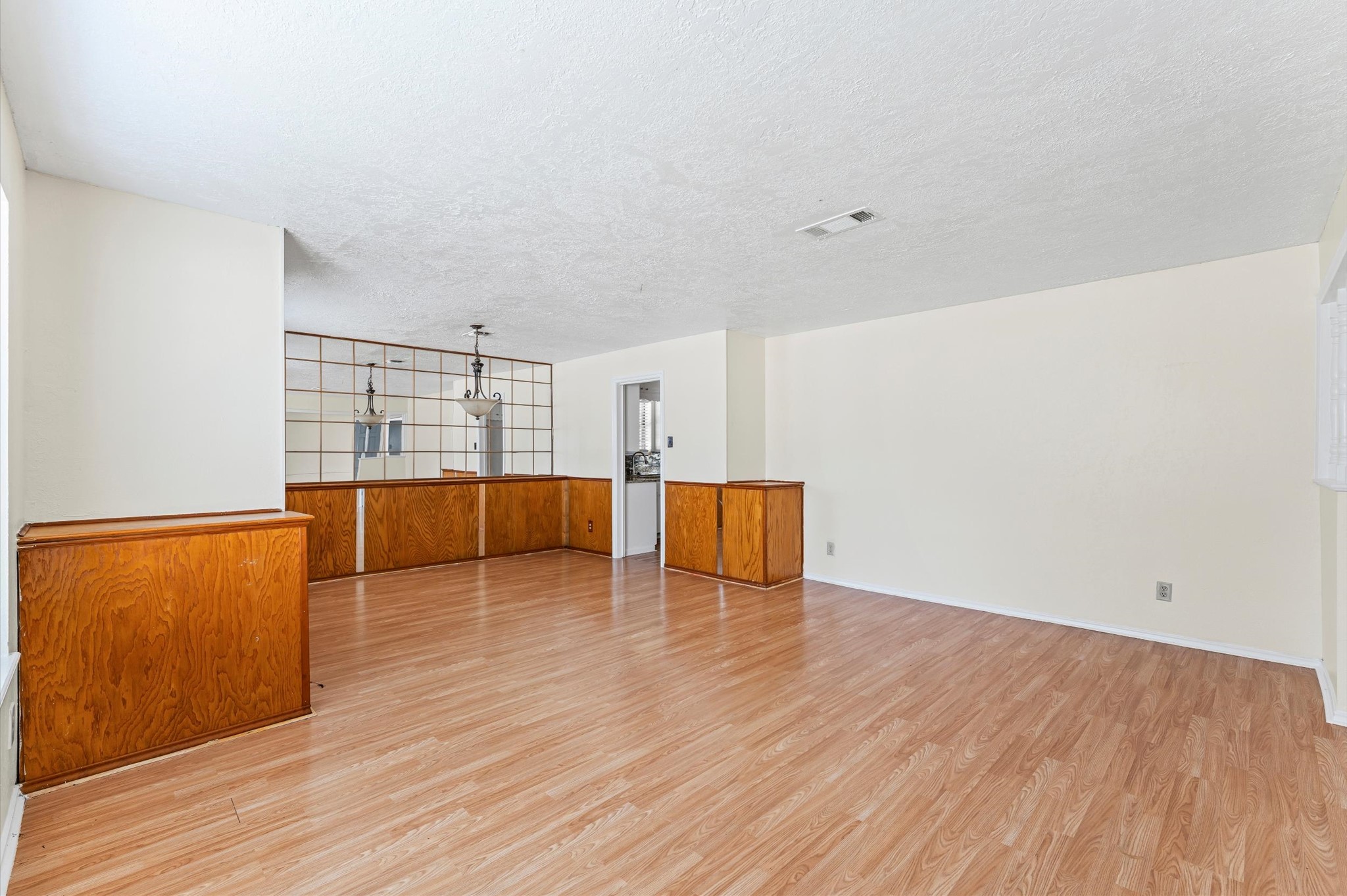 2709 Adams Street Alvin, TX 77511 - Photo 6 of 32 a view of empty room with wooden floor