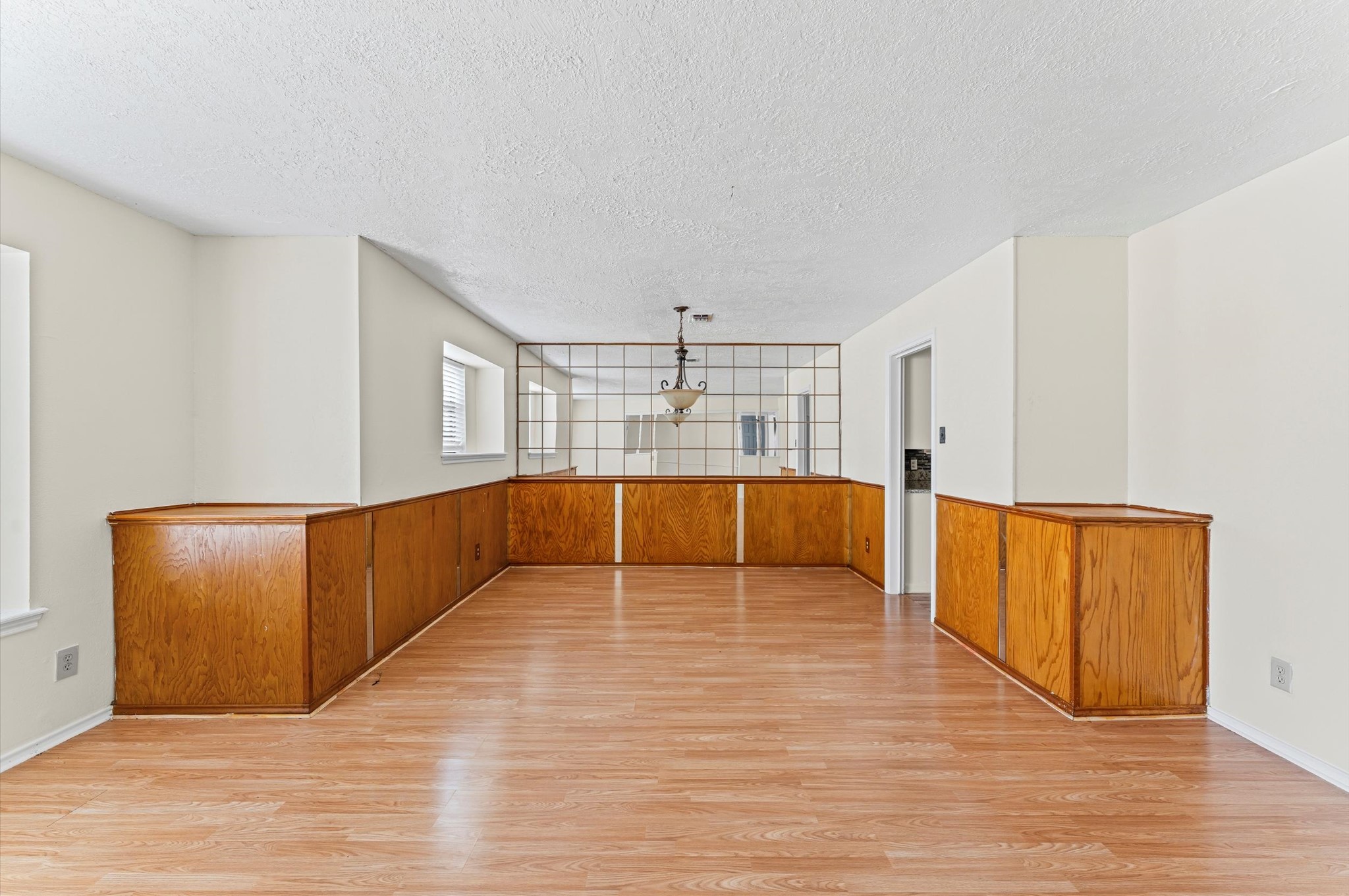 2709 Adams Street Alvin, TX 77511 - Photo 8 of 32 a view of an empty room with wooden floor