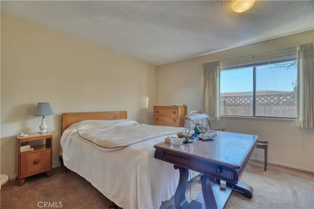 a bed room with a bed and a table