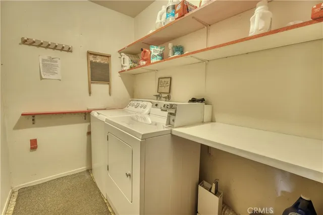 a utility room with a sink washer and dryer