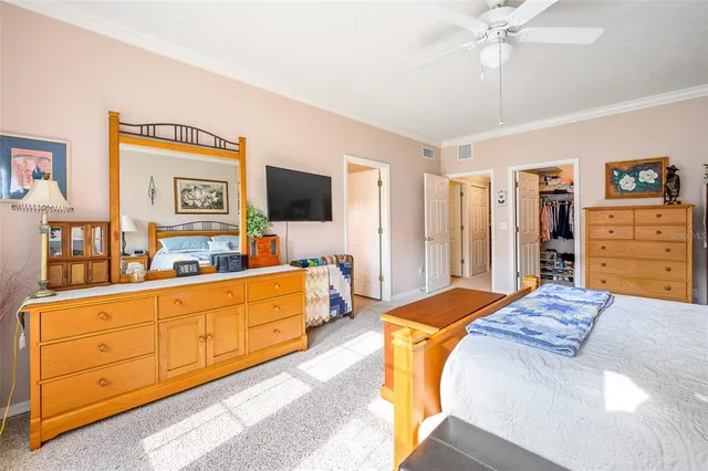 a bed room with a bed and a television