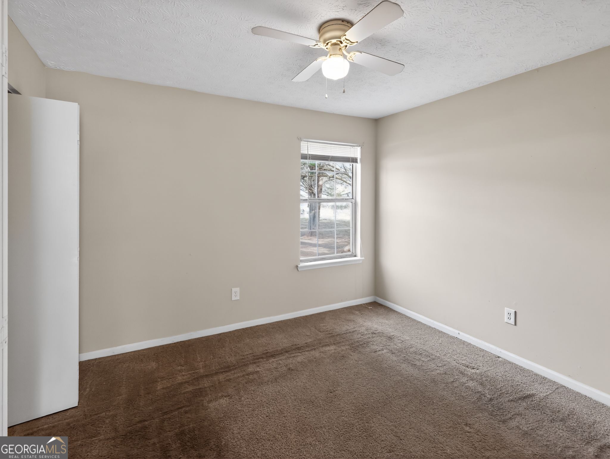 2492 Deep Shoals Circle Decatur, GA 30034 - Photo 17 of 31 an empty room with windows and fan