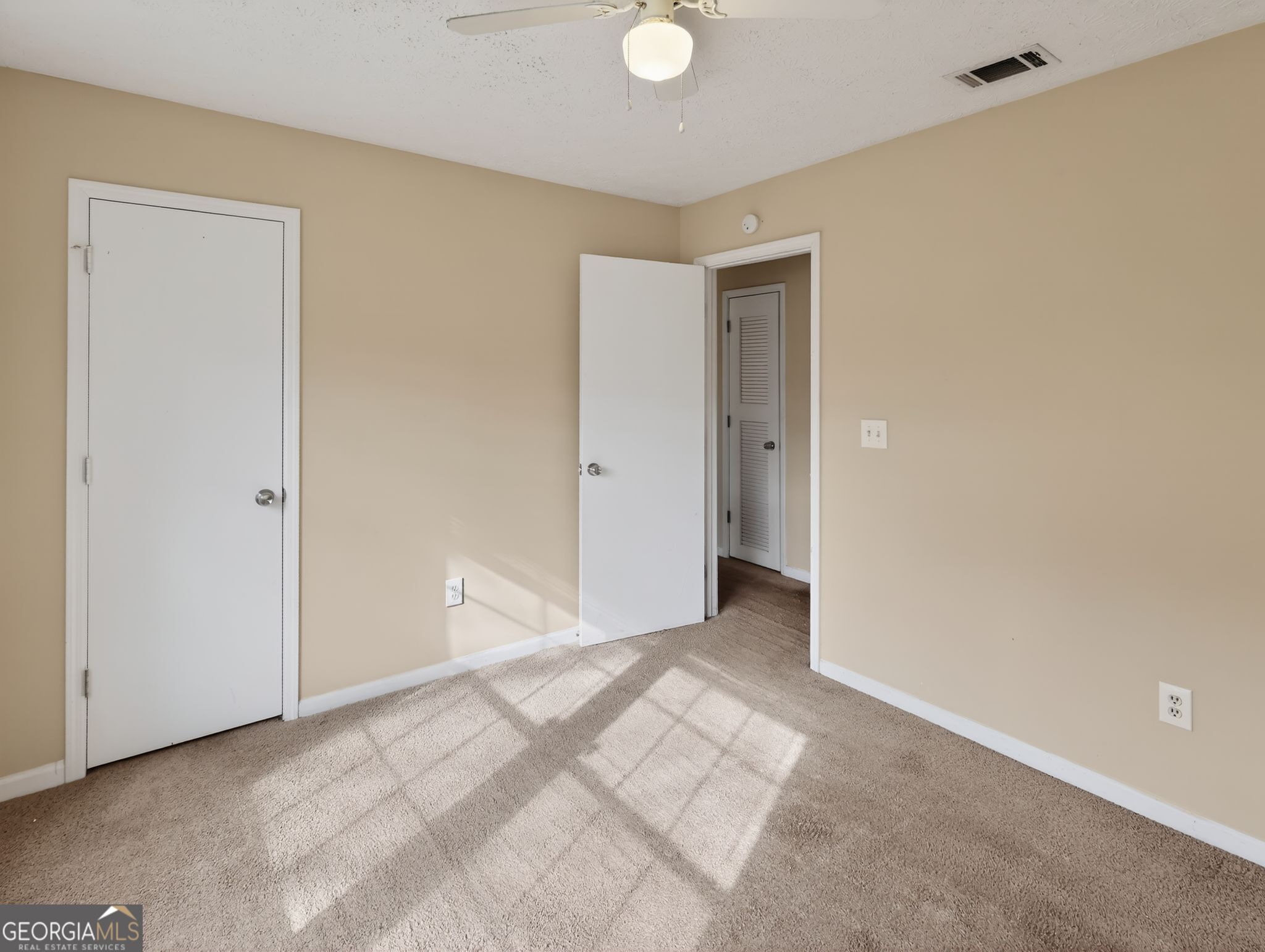 2492 Deep Shoals Circle Decatur, GA 30034 - Photo 20 of 31 a view of an empty room with window and closet area
