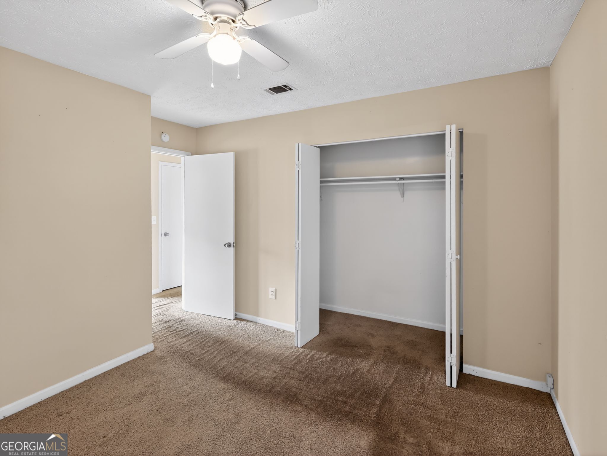 2492 Deep Shoals Circle Decatur, GA 30034 - Photo 21 of 31 a view of an empty room with a ceiling fan