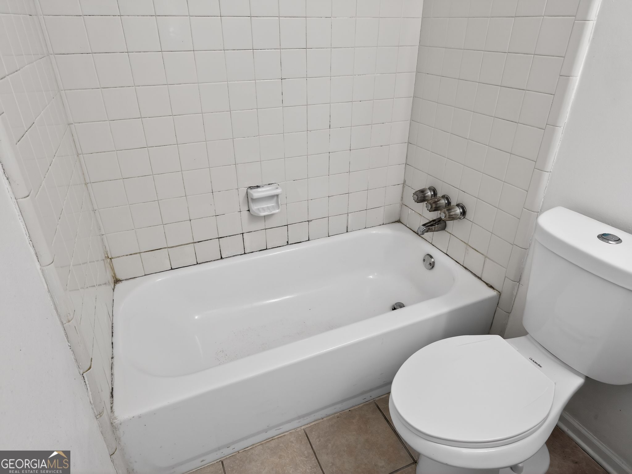 2492 Deep Shoals Circle Decatur, GA 30034 - Photo 23 of 31 a white toilet sitting next to a bath tub