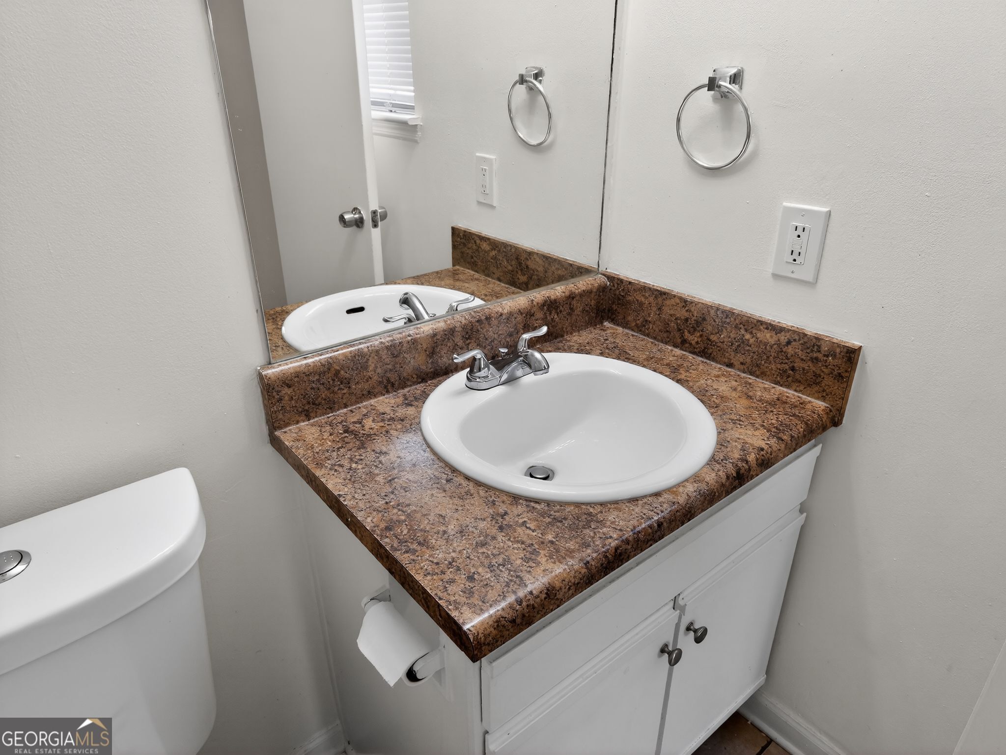 2492 Deep Shoals Circle Decatur, GA 30034 - Photo 25 of 31 a bathroom with a granite countertop sink a toilet and a mirror