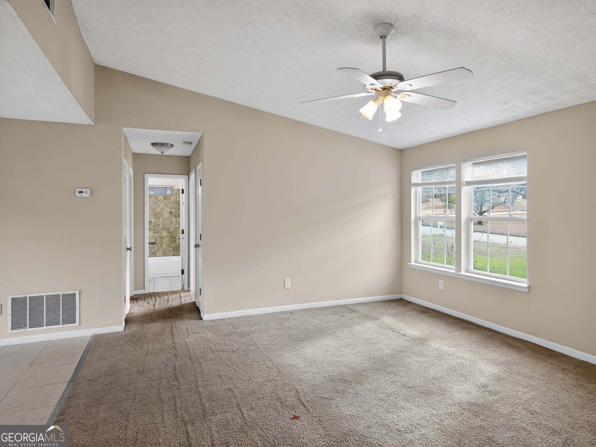 2492 Deep Shoals Circle Decatur, GA 30034 - Photo 7 of 31 a view of an empty room with a window