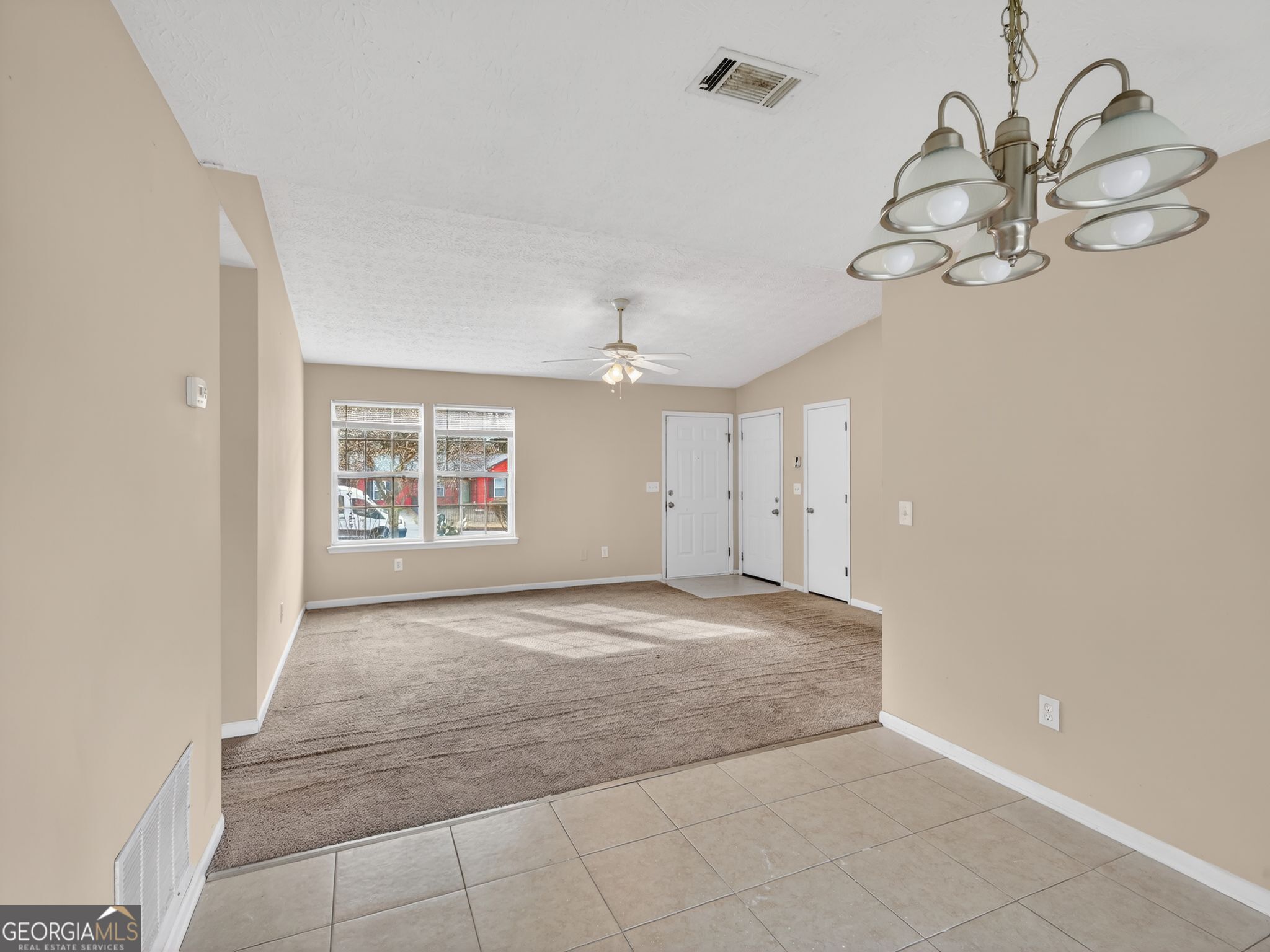 2492 Deep Shoals Circle Decatur, GA 30034 - Photo 9 of 31 an empty room with windows and ceiling fan