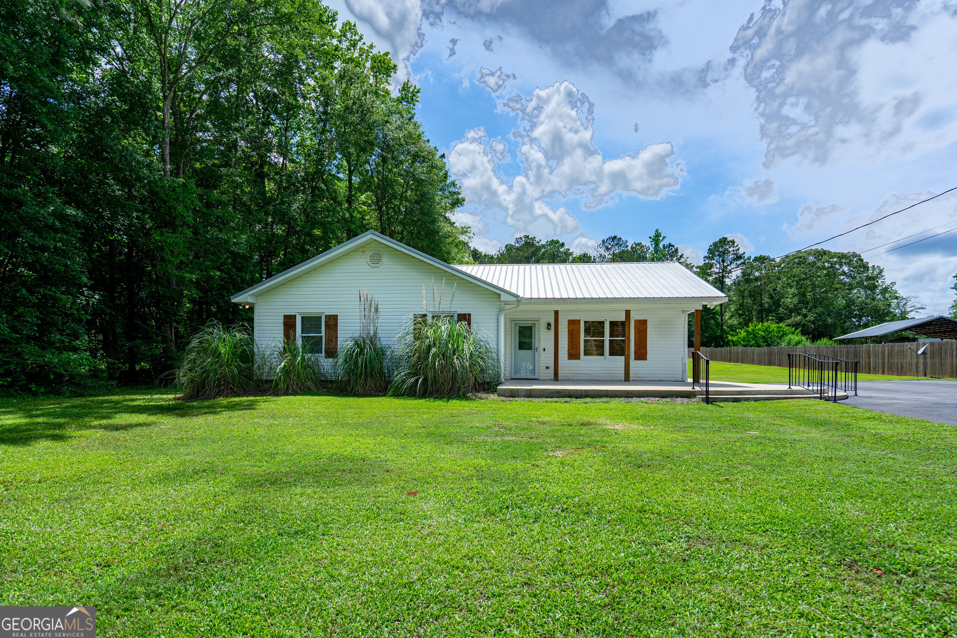 a front view of a house with table and chairs