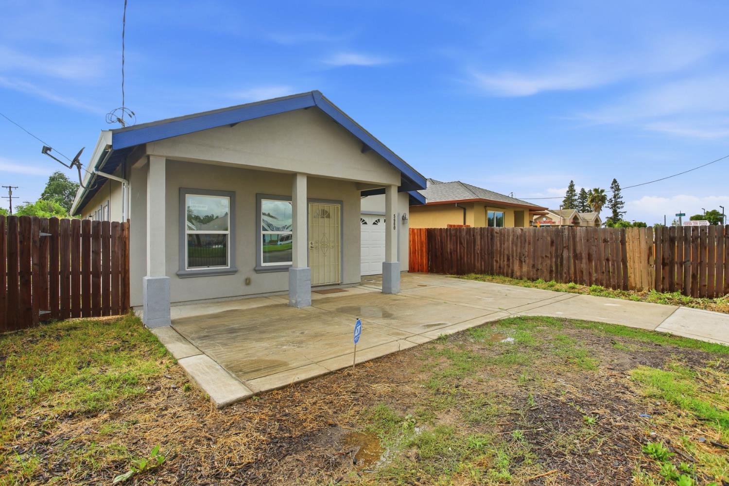 5680 Power Inn Road Sacramento, CA 95824 - Photo 3 of 48 a view of a house with backyard and wooden fence