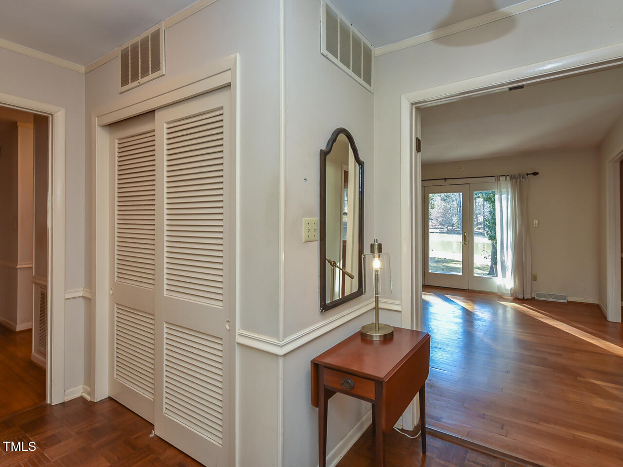 5200 Newhall Road Durham, NC 27713 - Photo 19 of 35 a view of a hallway with wooden floor and windows