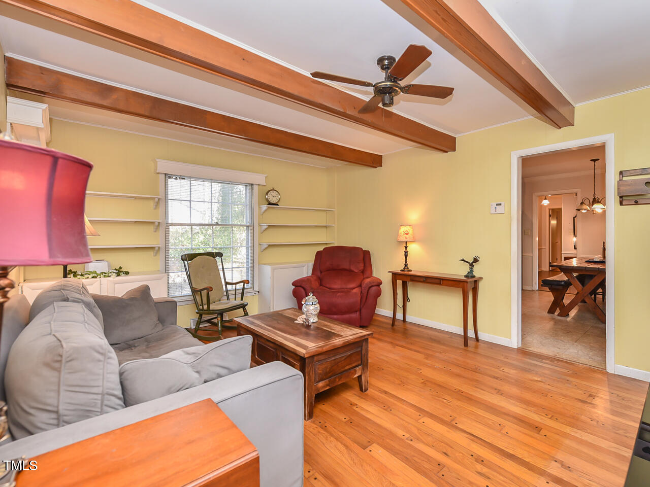 5200 Newhall Road Durham, NC 27713 - Photo 22 of 35 a living room with furniture and a floor to ceiling window