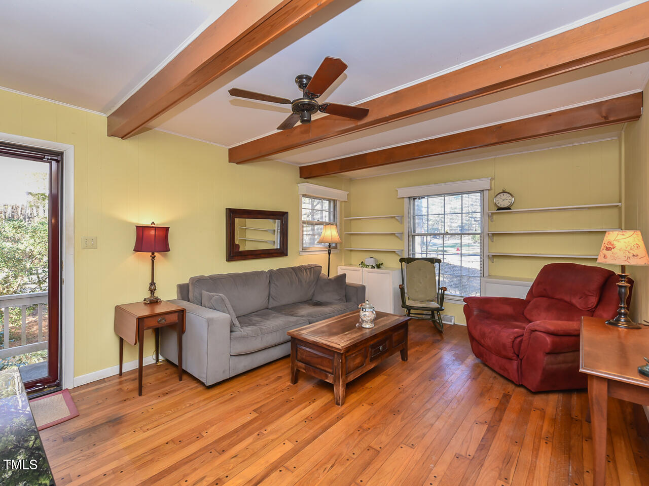 5200 Newhall Road Durham, NC 27713 - Photo 23 of 35 a living room with furniture a ceiling fan and a window