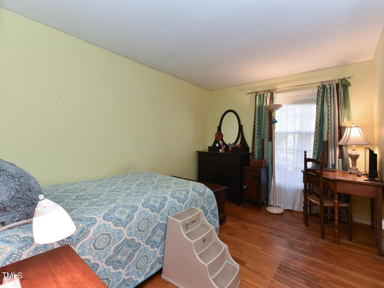 5200 Newhall Road Durham, NC 27713 - Photo 25 of 35 a bedroom with a bed and a table