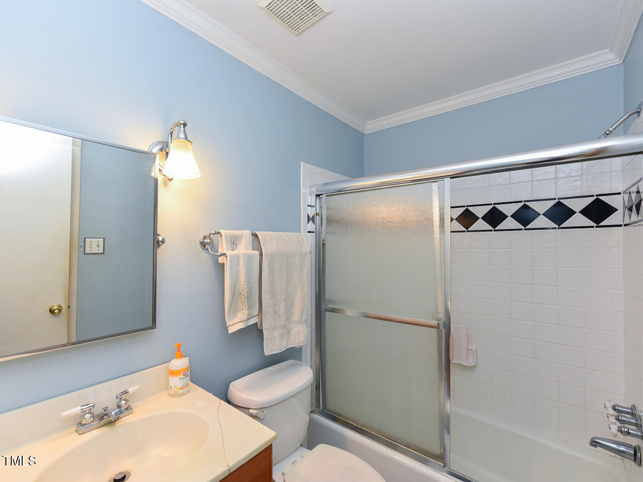 5200 Newhall Road Durham, NC 27713 - Photo 26 of 35 a bathroom with a sink toilet and shower