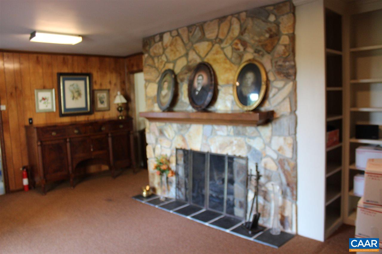 303 Evans Mill Road Dillwyn, VA 23936 - Photo 11 of 14 a living room with furniture and a fireplace
