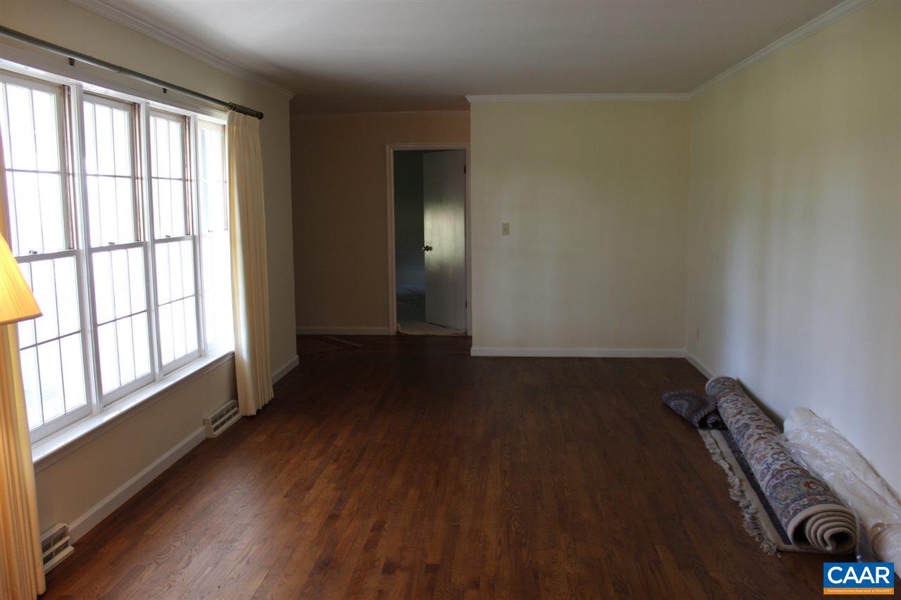 303 Evans Mill Road Dillwyn, VA 23936 - Photo 14 of 14 an empty room with wooden floor and windows