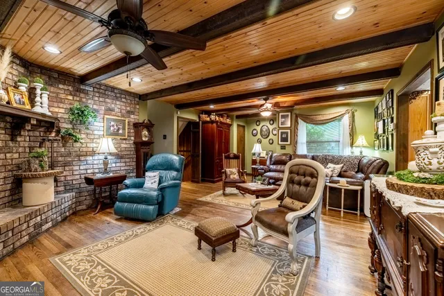a bedroom with a bed next to a large window with the outer view