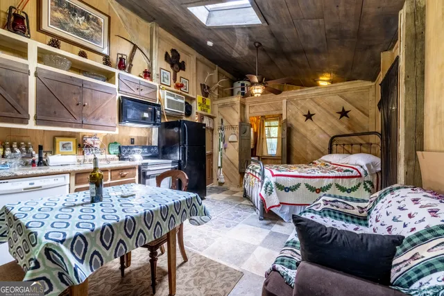 a front view of a house with a garden and trees