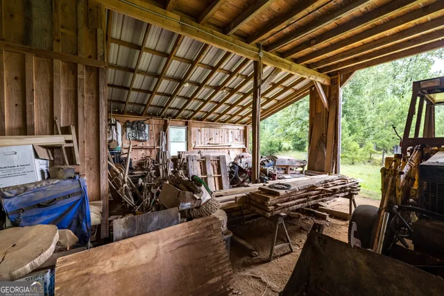 a view of a balcony with two chairs and a table