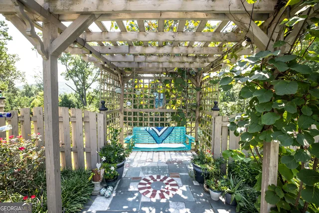 a view of a backyard with plants and a garden